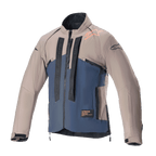 Alpinestars Techdura jas, off-road motorjas, Falcon Brown en Night Navy, vooraanzicht, tweekleurige constructie met verticale zwarte Alpinestars-branding, oranje logo op de schouder, hoge kraag en ritssluiting aan de voorzijde, technische kleding voor enduro- en adventure-rijden.