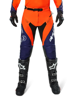 Alpinestars Pro-Dura Pants, Motocross and Enduro Pants, Navy Hot Orange and White, featuring black panels and white logos, worn with black off-road boots and gloves, professional protective gear for trail and off-road riding