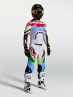Alpinestars Supertech Dyna broek, heren motocrossbroek in lichtlila en fluogroen, deel van een volledige race-uitrusting.
