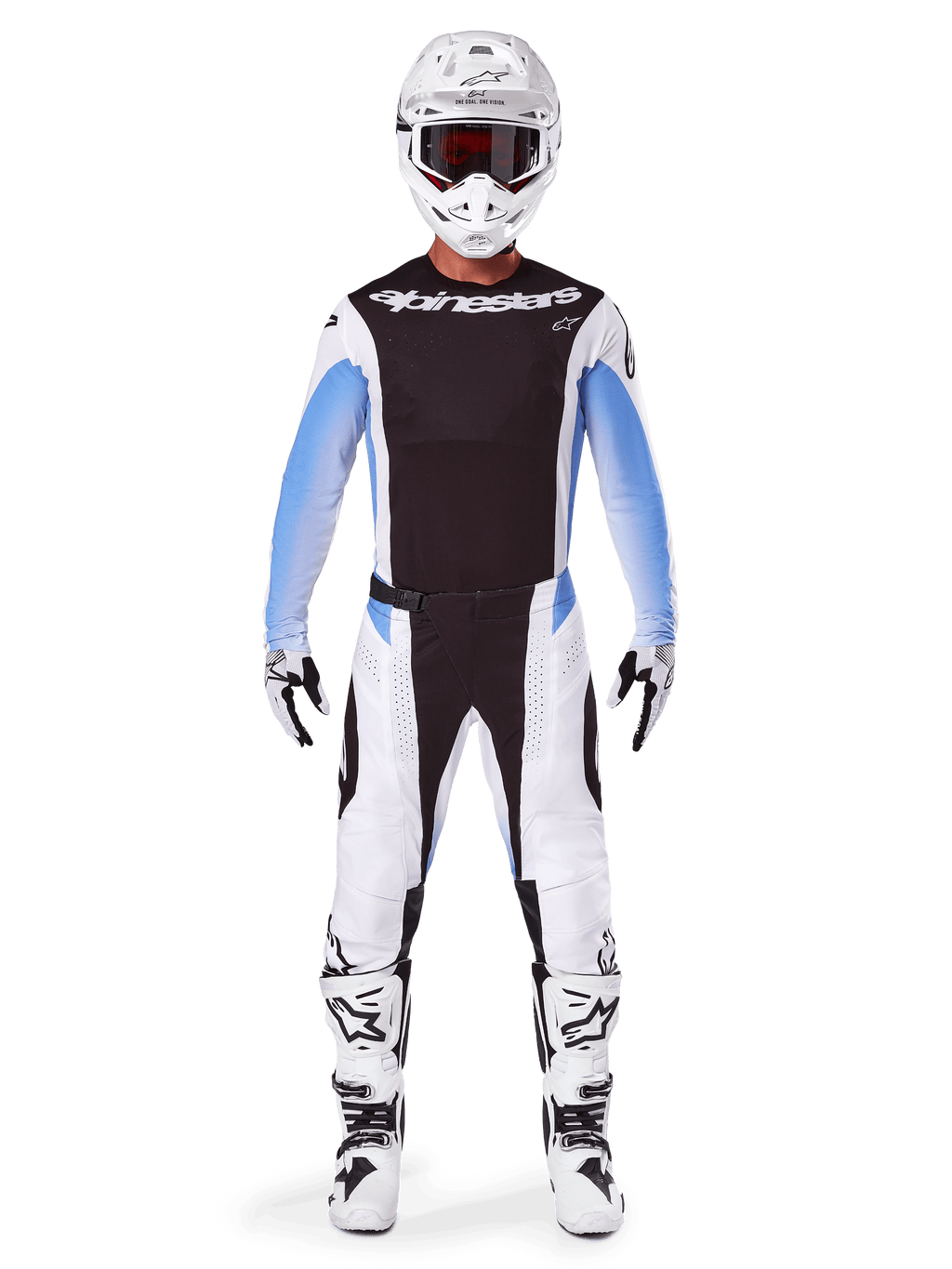 Motocrossrijder in Alpinestars 2025 Techstar Melt broek, motorcrossbroek, zwart en blauw, wit en zwart multi-panel ontwerp met blauwe heupaccenten, gedragen met bijpassende witte jersey, witte helm, witte handschoenen en laarzen voor een complete off-road race-uitrusting
