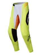 Alpinestars 2025 Techstar Melt crossbroek, motorcross broek, neon geel en zwart met witte en oranje accenten, grote zwarte Alpinestars-logo's, lasergesneden ventilatieperforaties en duurzame panelen voor off-road racing