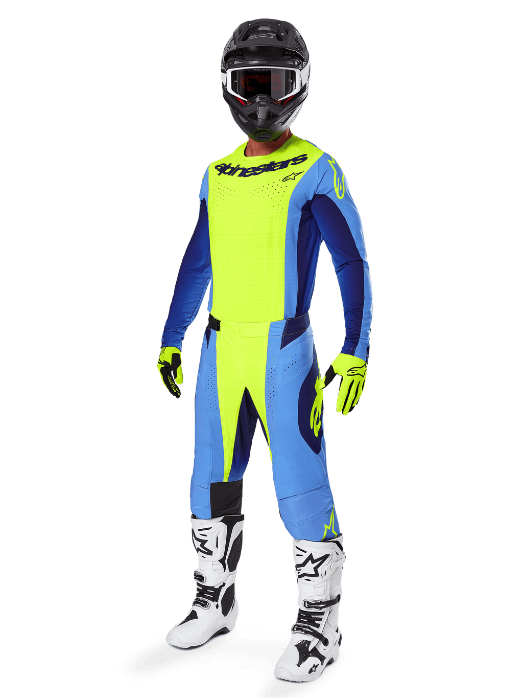 Alpinestars 2025 Techstar Melt crossbroek, motorcross broek, fluogeel en blauw, gedragen als onderdeel van een complete race-uitrusting met bijpassende jersey, geel-zwarte handschoenen, wit-zwarte laarzen en zwarte helm met witte bril, gecoördineerde off-road prestatiekleding.