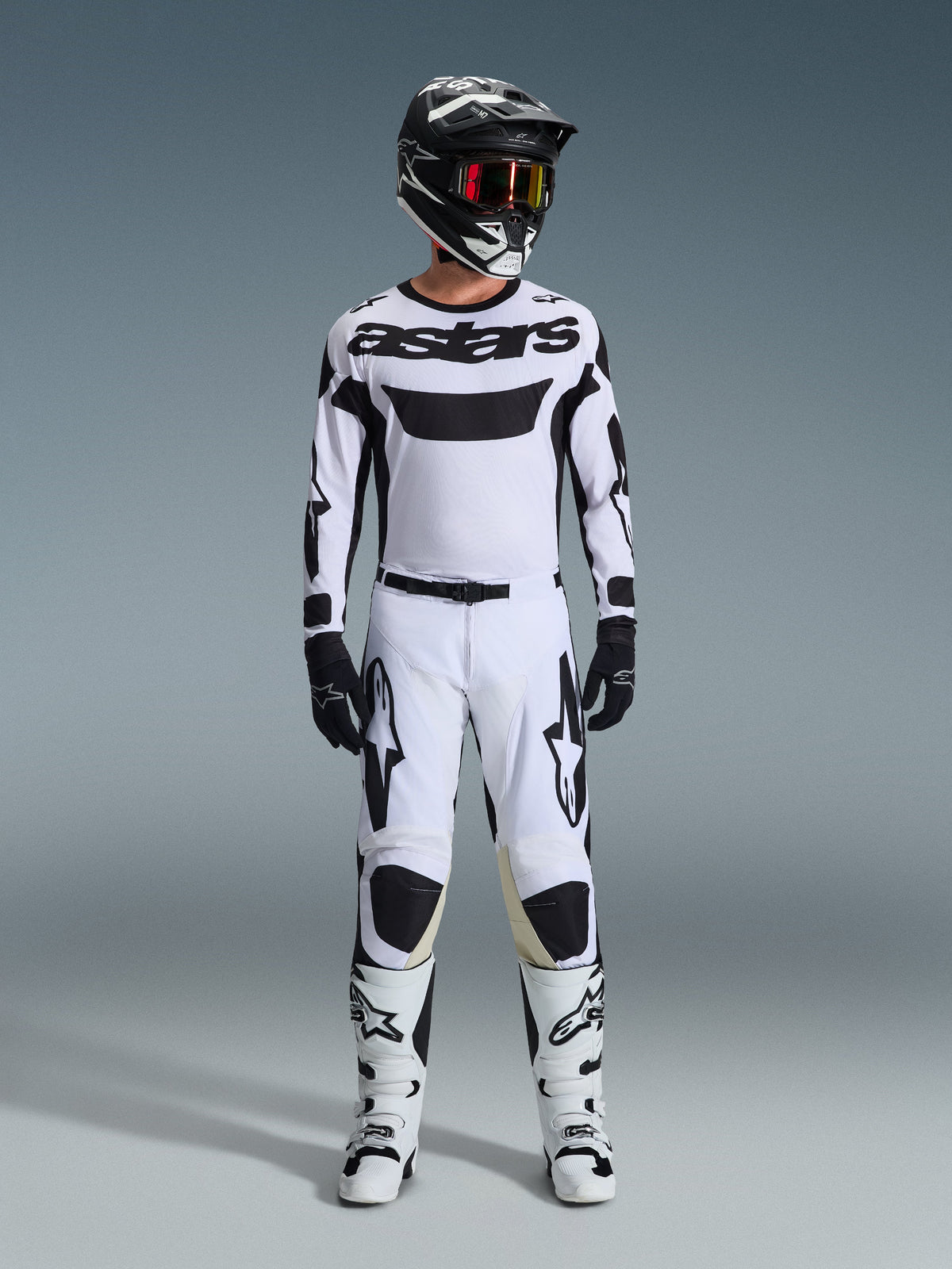 Alpinestars 2026 Racer Riway Gear Set, Motocross Outfit, White and Black, complete racing kit featuring a white jersey with black Alpinestars branding, matching white pants with black accents, black helmet, and white boots, professional off-road racing gear