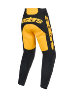 Alpinestars 2026 Racer Riway broek, motocrossbroek, geel en zwart, achteraanzicht met opvallende gele 'astars' branding op het zitvlak en de zijkant, zwarte onderbenen met mesh-panelen, ergonomische voorgevormde constructie voor off-road racing.