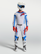 Alpinestars Supertech Vesta motorcrossset in wit, lichtlila en rood, met jersey, broek en motorlaarzen voor off-road racing.