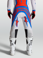 Alpinestars Supertech Vesta broek, pro-level motocrossbroek in licht lila en rood, athletische pasvorm met geperforeerde stretchstof.