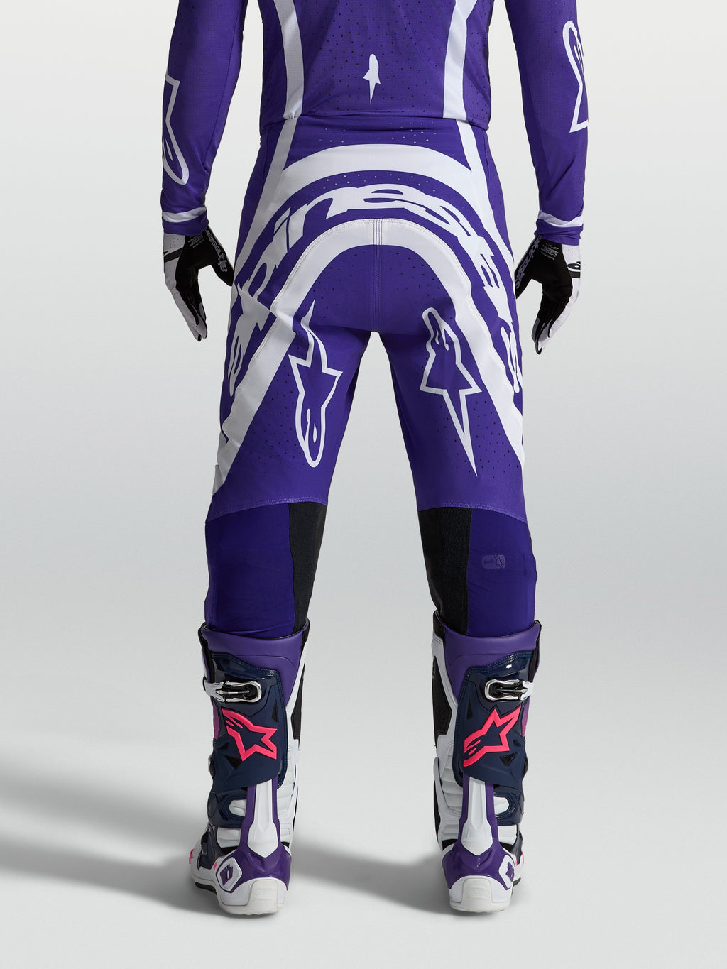 Alpinestars Men's Supertech Vesta Motocross Pants, Deep Blue and White, rear view showing athletic fit and rip-stop fabric.