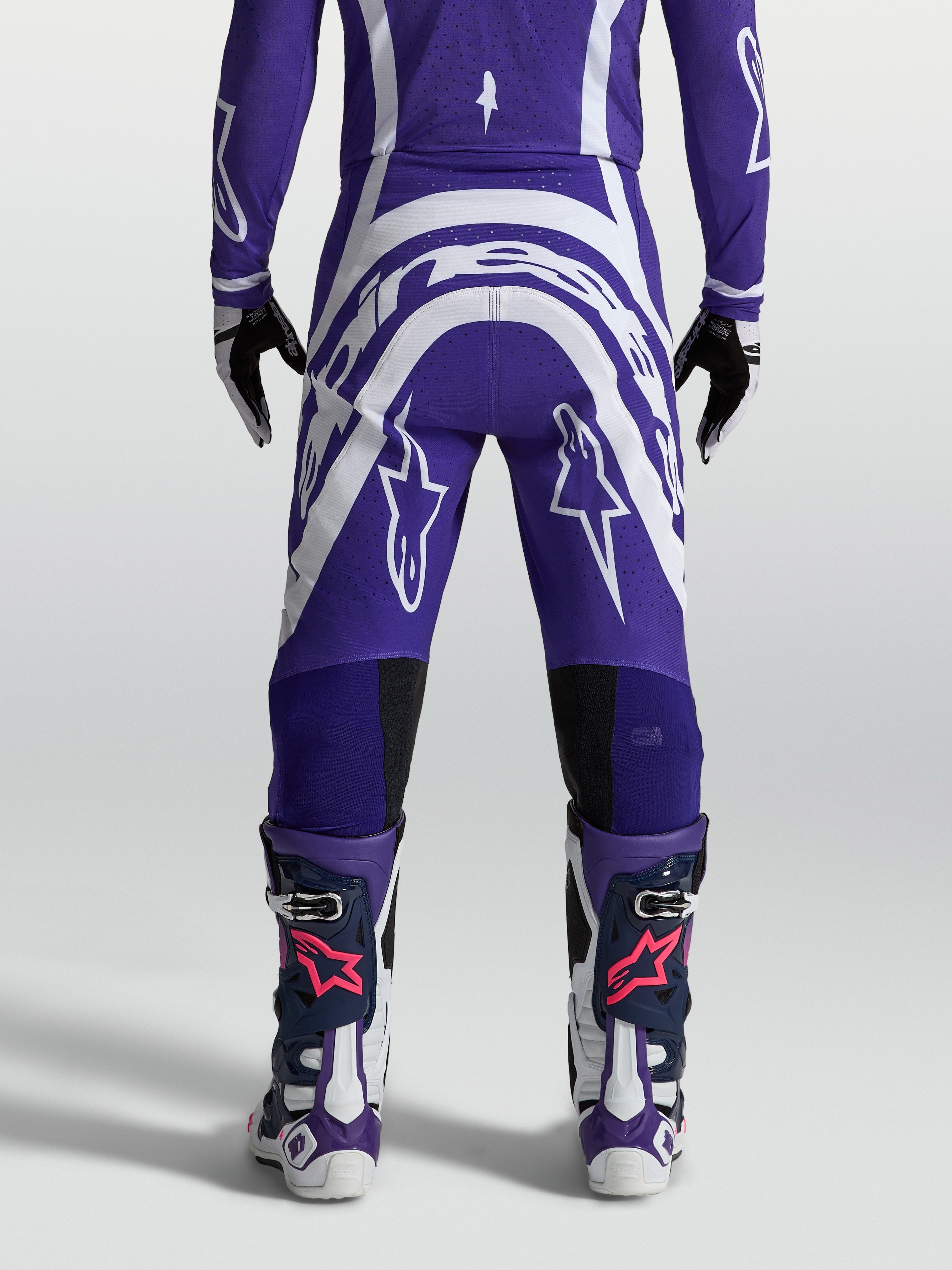 Alpinestars Men's Supertech Vesta Motocross Pants, Deep Blue and White, rear view showing athletic fit and rip-stop fabric.