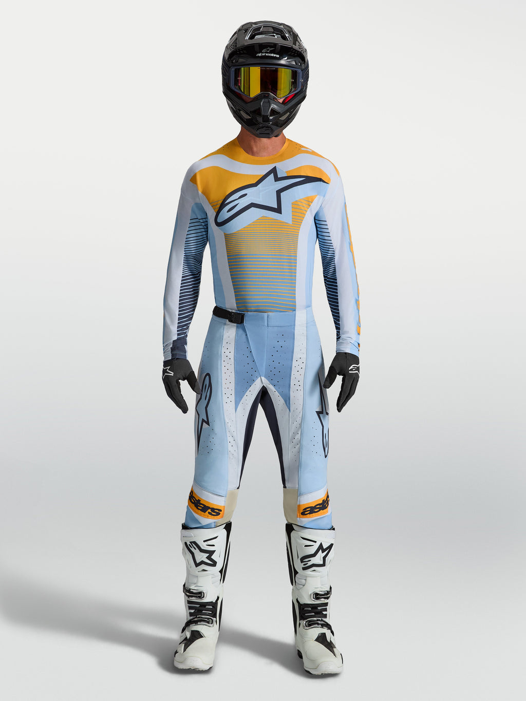 Alpinestars Techstar Maven broek in blauw en oranje, motorcrosskleding voor heren met racepasvorm en stretchzones.