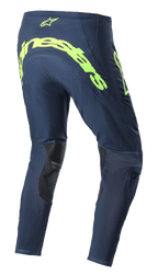 Alpinestars 2023 Supertech Bruin crossbroek, motorcross broek, Night Navy en fluorgeel, achteraanzicht met groot fluorgeel Alpinestars-logo op het zitvlak, geperforeerde ventilatiezones, zwarte verstevigingen aan de binnenkant van de benen