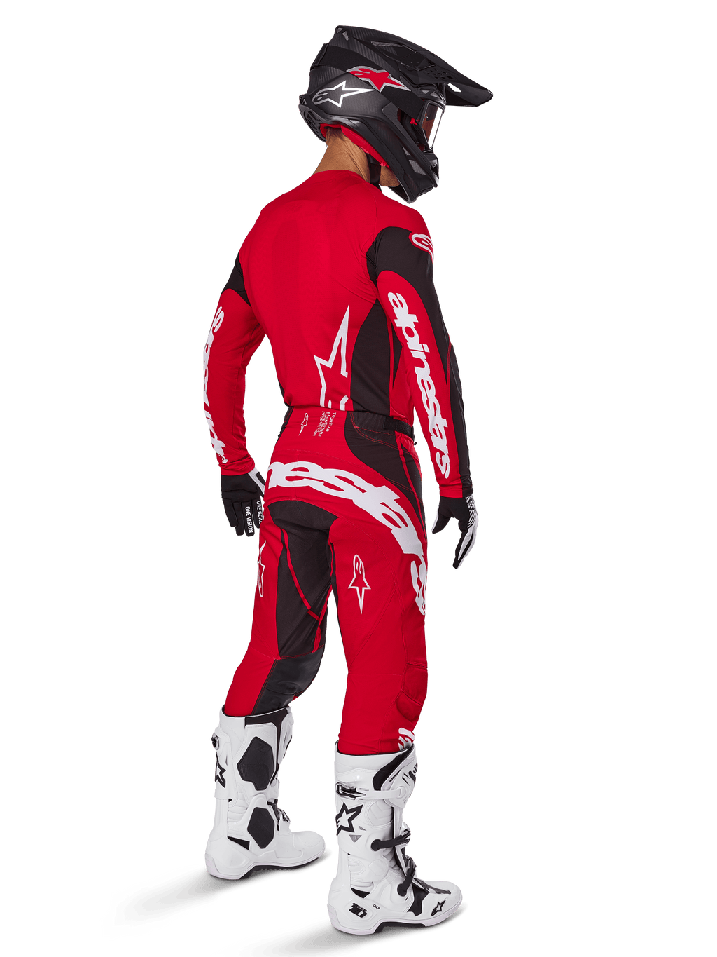 Alpinestars 2025 Techstar Dreem crossbroek, motorcross broek, felrood en zwart, gedragen door een rijder van achteren gezien in een volledige race-uitrusting met bijpassende rode jersey, zwarte helm en witte laarzen, opvallende witte Alpinestars-branding en zwarte stretchpanelen
