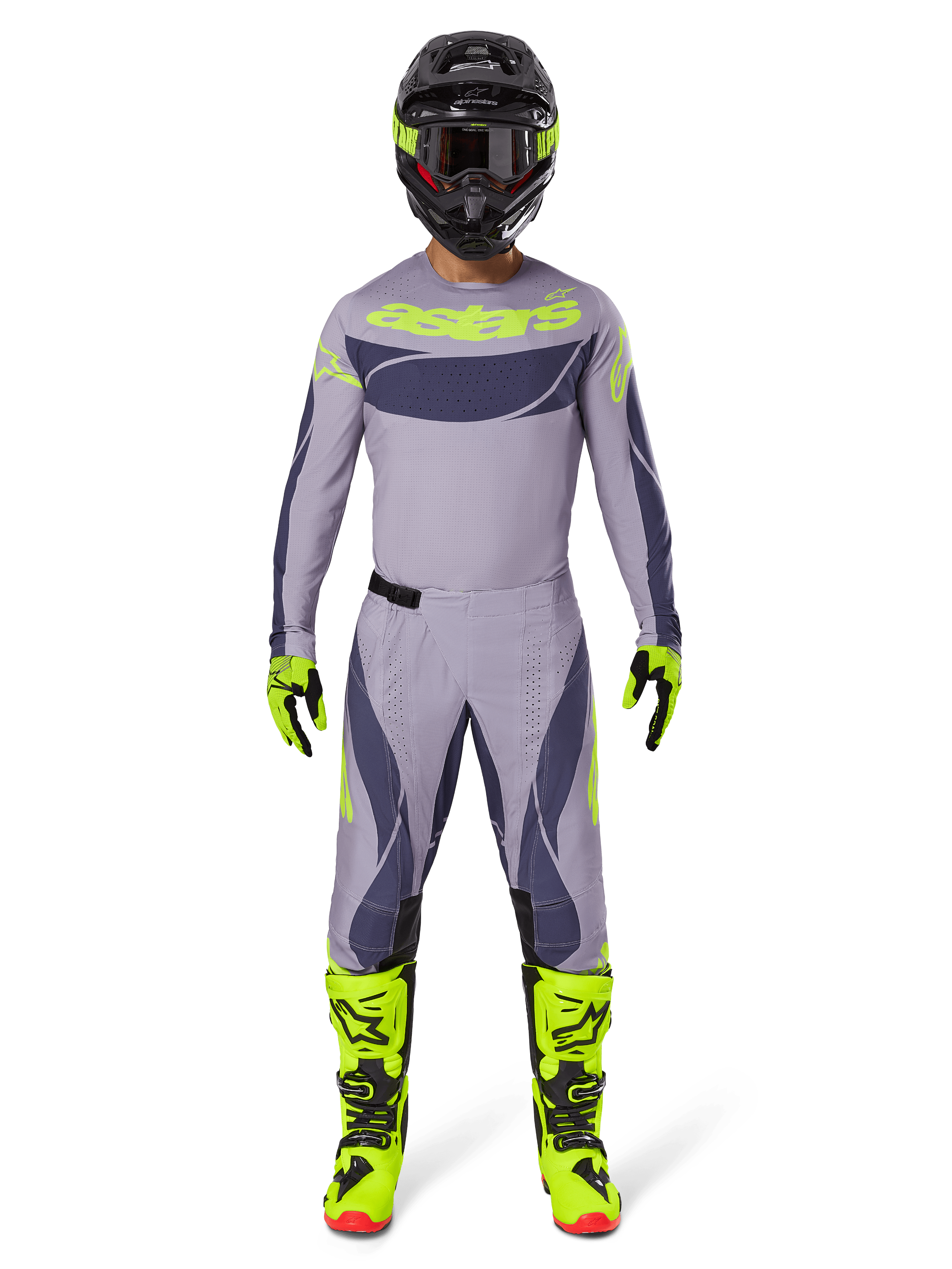 Motorcrosser in volledige race-uitrusting, Alpinestars 2025 Techstar Dreem Pants in grijs en donkergrijs, bijpassende jersey met fluorescerend gele branding, zwarte helm, fluorescerend gele laarzen en handschoenen, gecoördineerde performance-outfit voor off-road racen