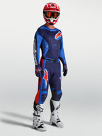 Alpinestars Racer Hunt broek, blauwe en rode motocrossbroek voor heren met een voorgevormde racepasvorm.