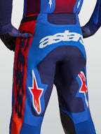 Alpinestars Racer Hunt heren-motorcrossbroek, blauw en rood met witte astars-branding en stergrafieken.