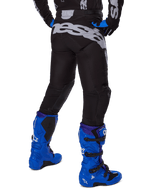 Alpinestars 2025 Racer Graphite Pants, Motocross Pants, Black and Gray, rear view with large gray branding on the seat, worn with bright blue motocross boots and black and blue jersey, durable off-road racing gear