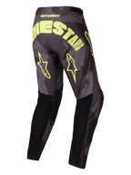 Alpinestars Racer Hollow Broek 2025, off-road motorcrossbroek, donker camo en geel fluo, lichtgewicht technisch materiaal met voorgevormde constructie, achteraanzicht met grote branding en sterlogo's
