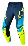 Alpinestars Techstar Factory Pants, Motocross Racing Pants, Dark Blue, Yellow Fluo and Light Blue, featuring black inner knee panels, yellow star logo on the thigh, "ONE GOAL ONE VISION" branding, and perforated ventilation zones for performance off-road gear