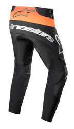 Alpinestars 2023 Techstar Sein crossbroek, motorcross broek, zwart en feloranje, achteraanzicht met feloranje taillepaneel en zwart logo, groot wit Alpinestars-logo op het zitvlak, versterkte textielconstructie voor off-road racing