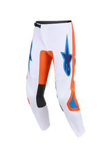 Alpinestars 2026 Fluid Grid Pants, Motocross Pants, White with Orange and UCLA Blue accents, featuring blue Astars logos on the thighs, black inner knee panels, and a technical ergonomic design for off-road performance.