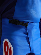 Alpinestars 2026 Fluid Grid Pants, Motocross Pants, Blue and Red, close-up view of the black ratchet waist closure system, durable blue polyfabric with red and white logo accent, engineered for off-road performance