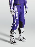 Alpinestars Fluid Apex V2 Broek, motocrossbroek voor heren, blauw en wit, met voorgevormde broekspijpen en duurzame constructie.