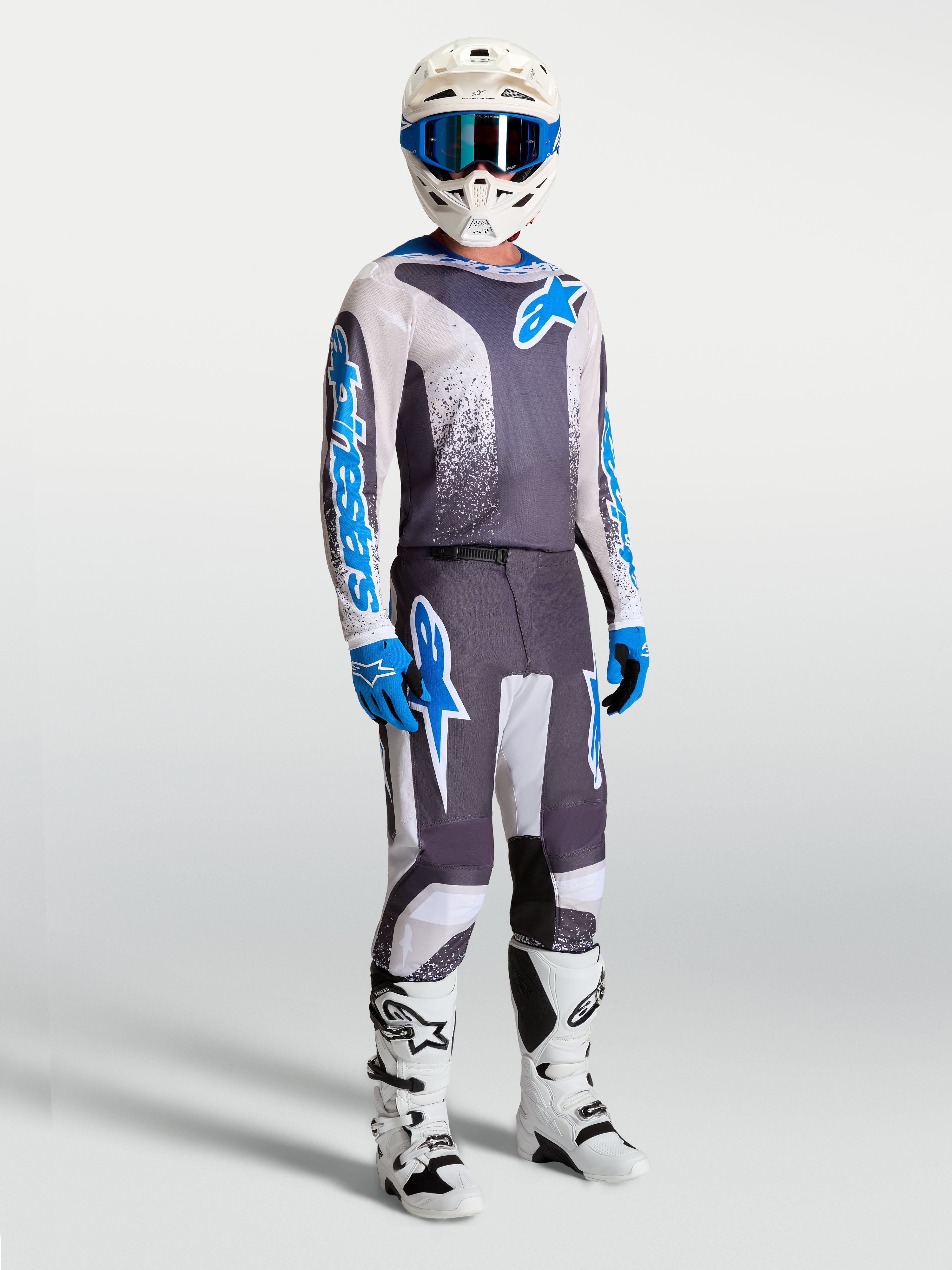 Alpinestars Fluid Drag broek en motorcrossset voor heren, grijs en blauw, ergonomisch 3D-ontwerp voor off-road prestaties.