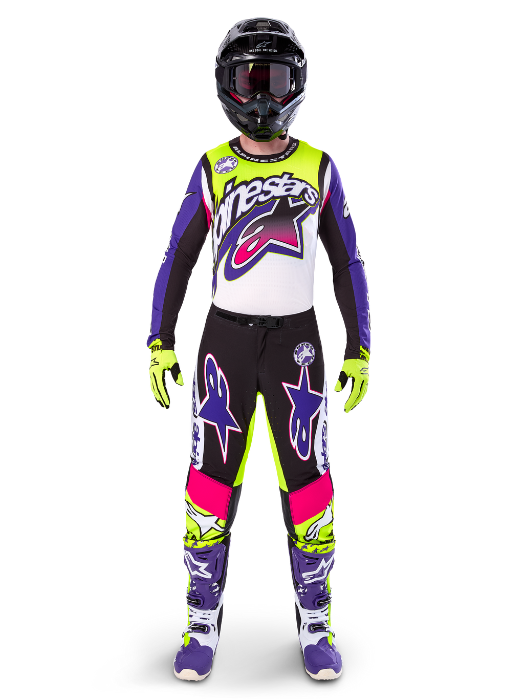 Alpinestars motorcrossrijder in volledige race-uitrusting, Limited Edition Supertech Dirt Studios jersey en broek in wit, paars en fluorgeel, zwarte helm met bril, paarse en witte laarzen, gecoördineerde levendige outfit voor off-road motorcross