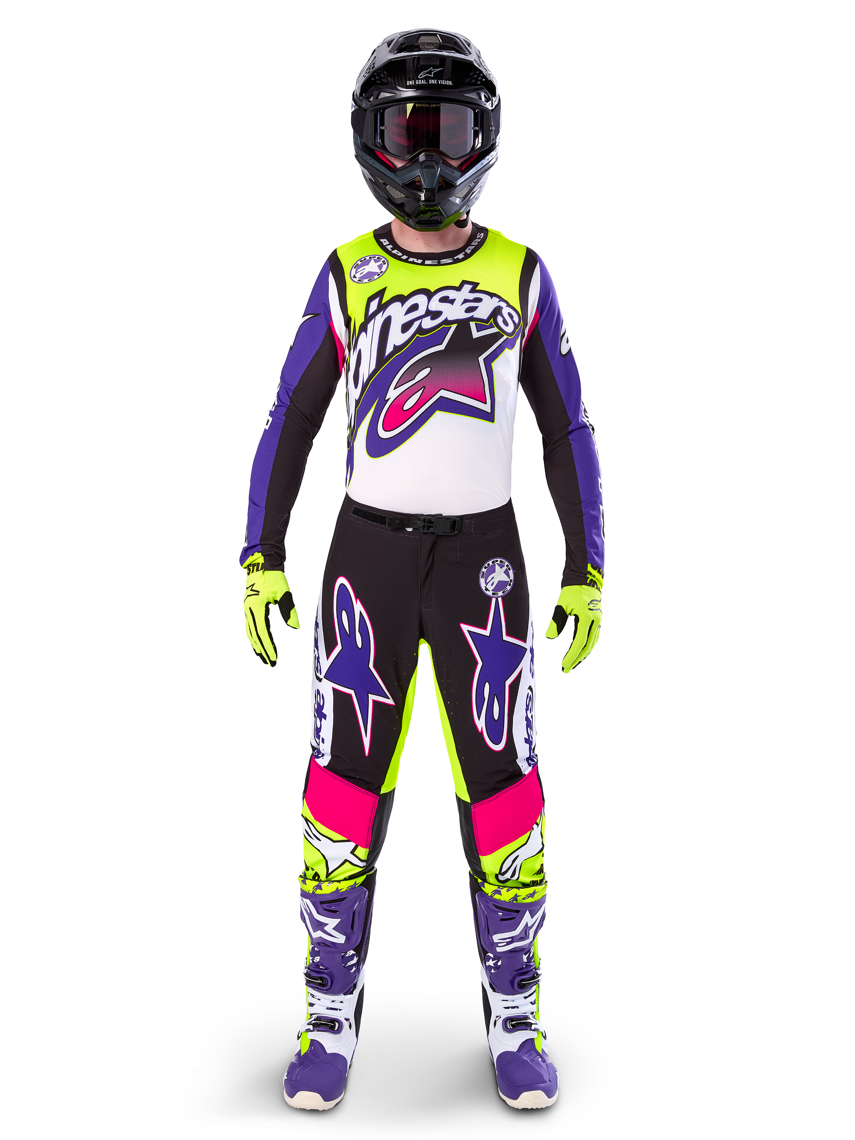 Alpinestars motorcrossrijder in volledige race-uitrusting, Limited Edition Supertech Dirt Studios jersey en broek in wit, paars en fluorgeel, zwarte helm met bril, paarse en witte laarzen, gecoördineerde levendige outfit voor off-road motorcross
