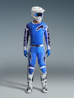 Alpinestars 2026 Racer Air Portl Gear Set, Motocross Racing Gear, Ucla Blue and White, complete outfit featuring a ventilated jersey, perforated pants with magnetic buckle, blue gloves, white boots, and a white helmet with blue goggles, high-performance breathable design for off-road riding
