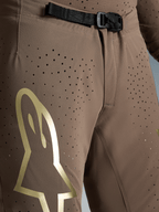 Alpinestars Limited Edition Supertech Air Gold Motocross Pants in Brown with gold logo and SX1 magnetic buckle.