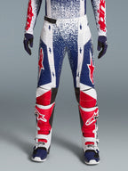 Alpinestars Techstar Unity limited edition heren-motorcrossbroek in rood, wit en blauw met sterrenpatroon.