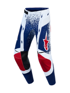 Alpinestars Techstar Unity broek, blauwe en witte motorcrossbroek met rode steraccenten en lederen kniebescherming.