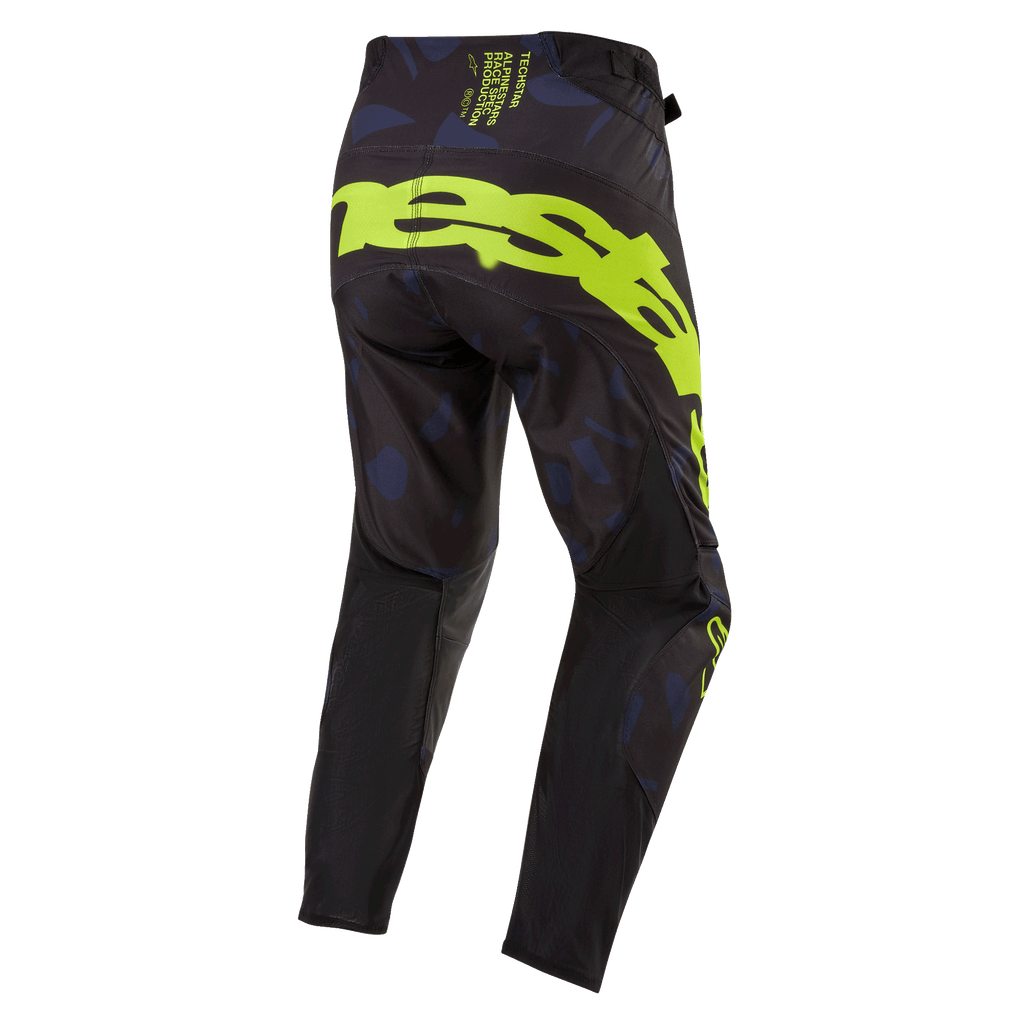 Alpinestars 2024 Techstar Rantera-broek, motorcrossbroek, zwart, navy en fluogeel, achteraanzicht met opvallende fluogele branding op het zitvlak, navy panelen met patroon en technisch zwart materiaal voor off-road raceprestaties