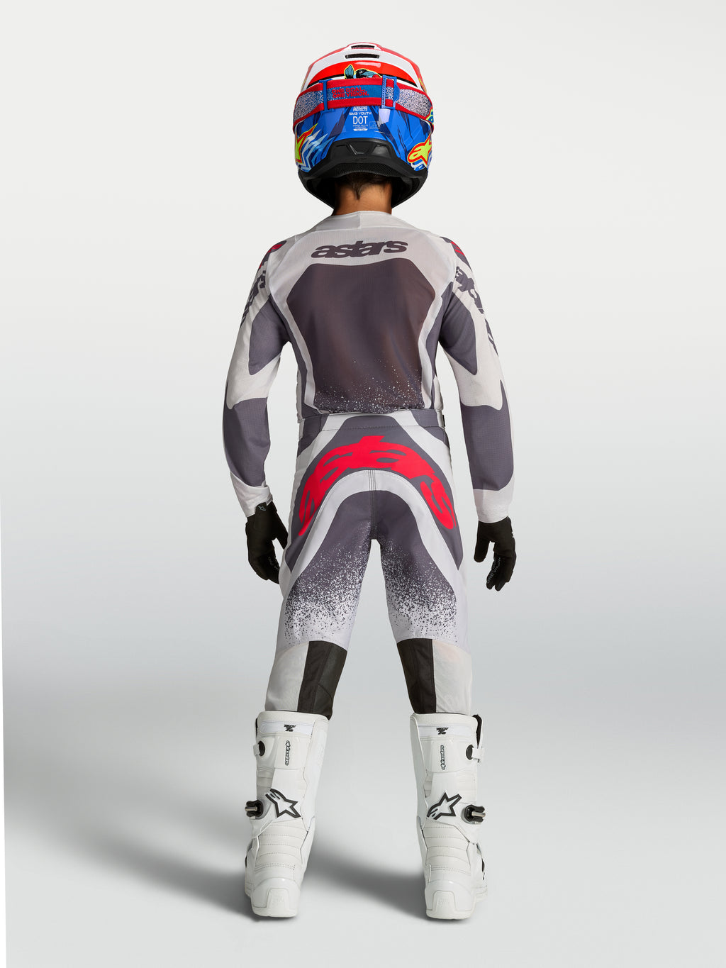 Alpinestars Jeugd Supertech Swan broek, grijze en fluo rode motocross-race-uitrusting voor de jeugd, achteraanzicht.