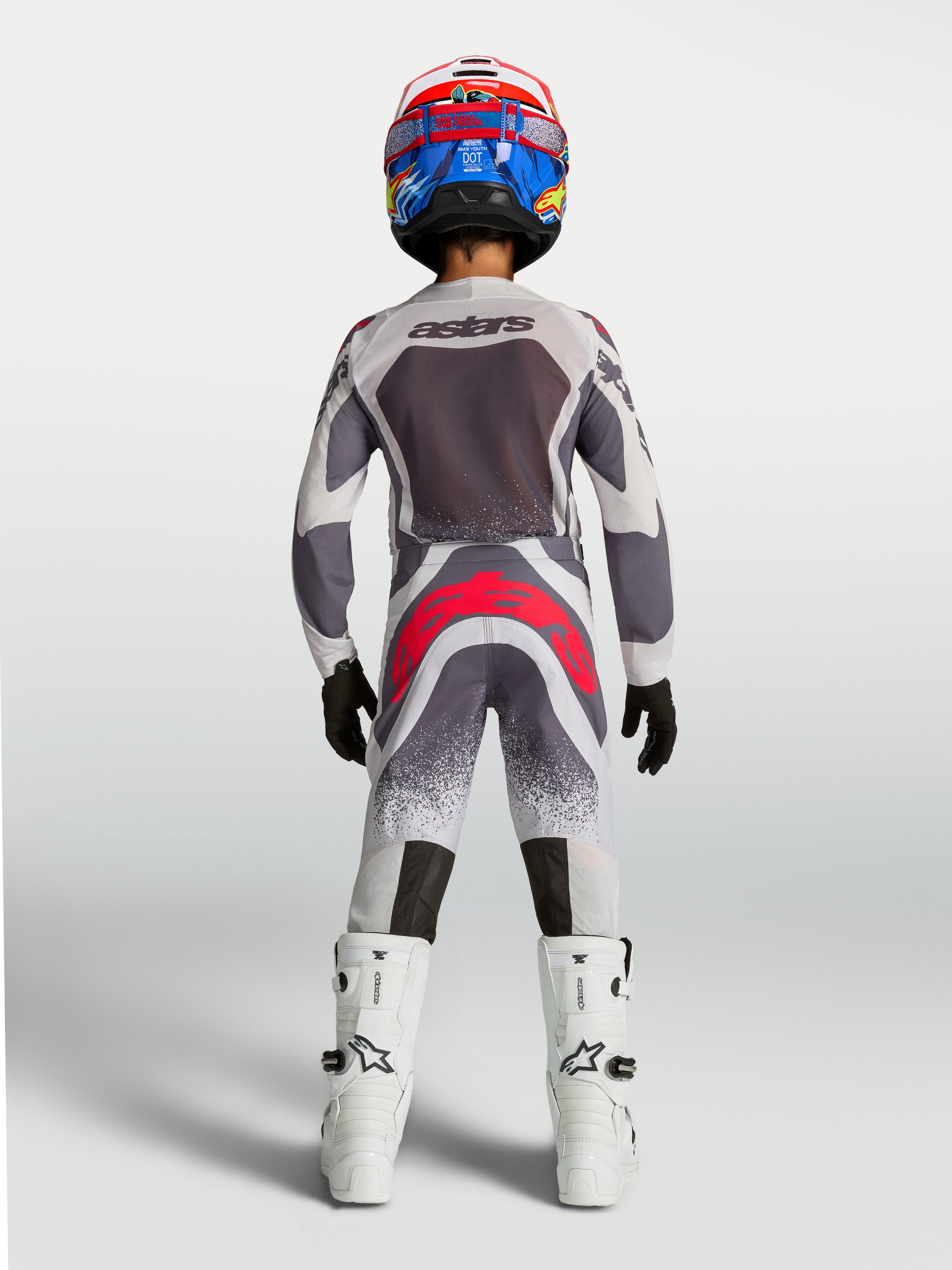 Alpinestars Jeugd Supertech Swan broek, grijze en fluo rode motocross-race-uitrusting voor de jeugd, achteraanzicht.