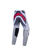 Alpinestars jeugd Supertech Swan motorcrossbroek, grijs en rood, atletische racepasvorm met groot logo op de achterzijde.