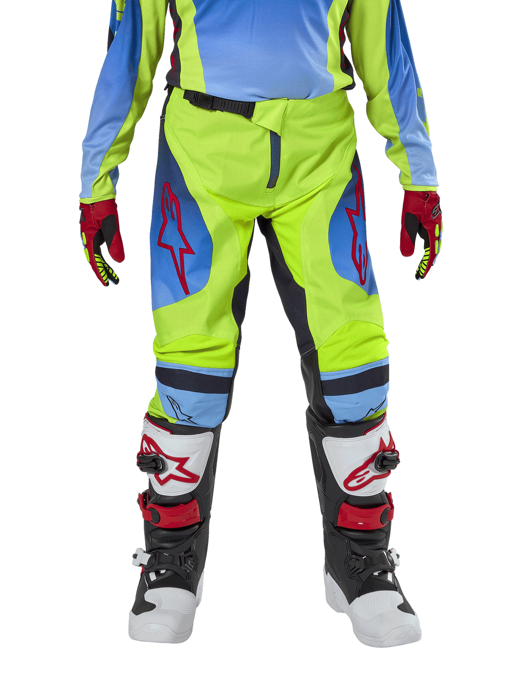 Alpinestars Youth 2024 Racer Hoen broek, motorcross broek, neongeel en donkerblauw, met rode sterlogo's op de dijen, gedragen met bijpassende jersey, rood-zwarte handschoenen en witte, zwarte en rode motorcrosslaarzen, duurzame uitrusting voor off-road rijden