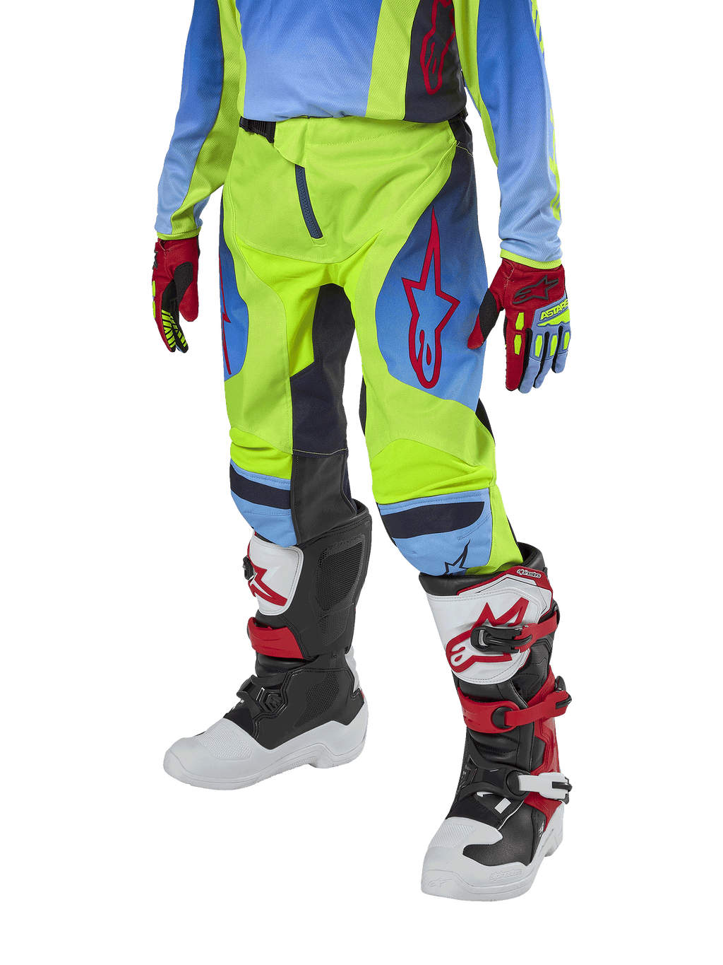 Alpinestars Youth 2024 Racer Hoen motorcrossbroek, jeugd crossbroek, neongeel en Blue Night Navy met rode accenten, gedragen met bijpassende handschoenen en witte, zwarte en rode laarzen, sportieve pasvorm en voorgevormde pijpen voor off-road racen