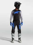Alpinestars Supertech Hiten AFD Jersey and Gear Set, black and blue men's motocross racing apparel with ergonomic fit.