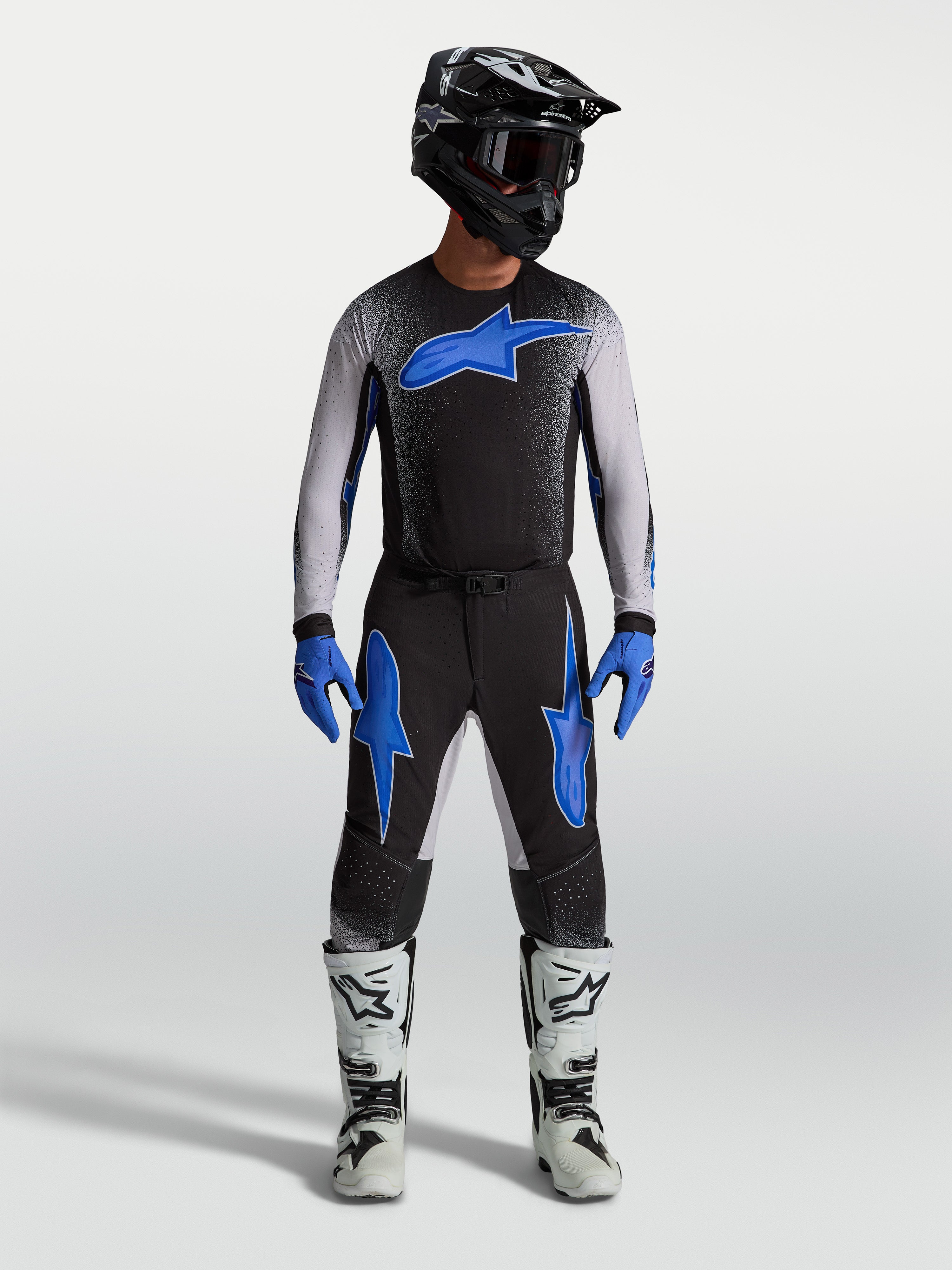 Alpinestars Supertech Hiten AFD Jersey and Gear Set, black and blue men's motocross racing apparel with ergonomic fit.