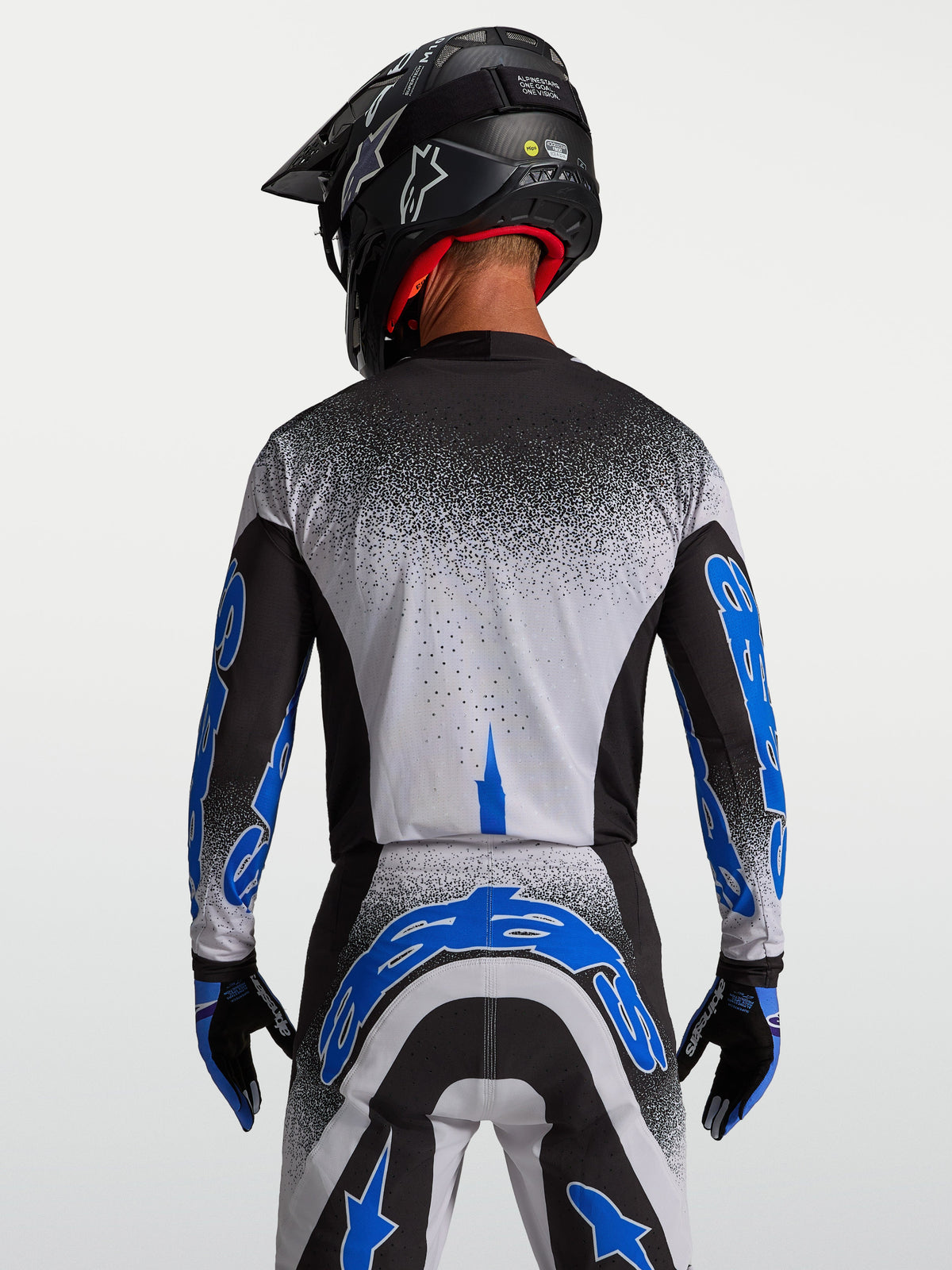 Alpinestars Supertech Hiten AFD jersey, motocross racing jersey voor heren, zwart en blauw, achteraanzicht met atletische pasvorm.