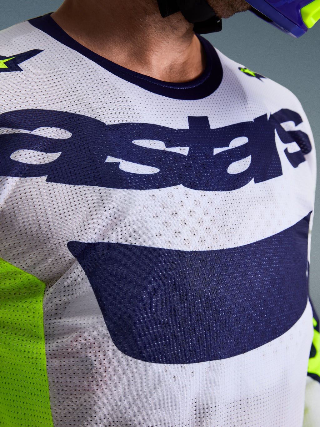 Alpinestars 2026 Racer Air Riway Jersey, Motocross Jersey, Light Gray Yellow Fluo and Blue, close-up of chest featuring breathable mesh airflow construction and navy blue astars logo, designed for high-performance off-road riding.