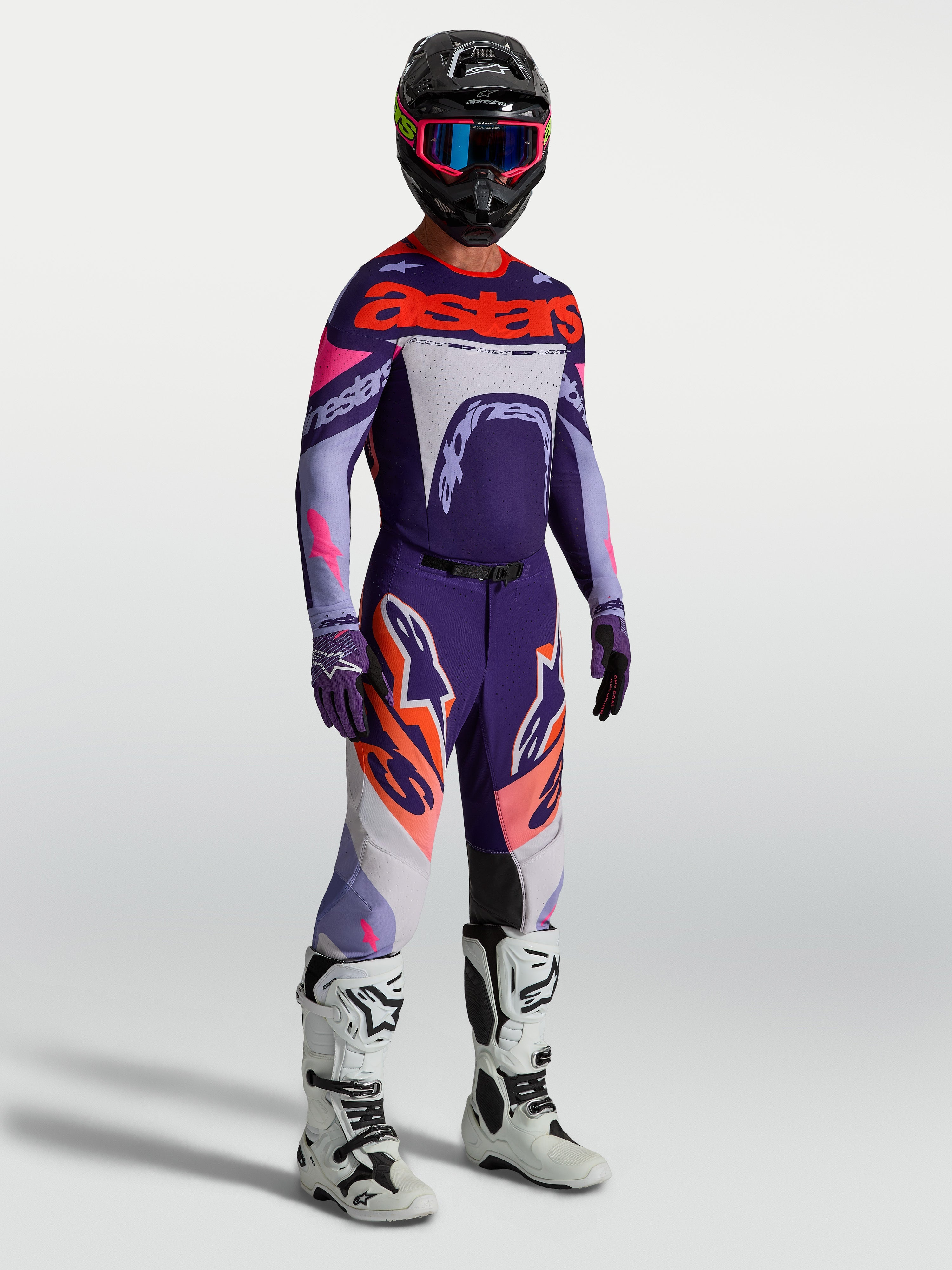 Alpinestars Supertech Dyna Gear Set, paars en roze fluo heren-motocrossoutfit met atletische pasvorm en stretchmesh.