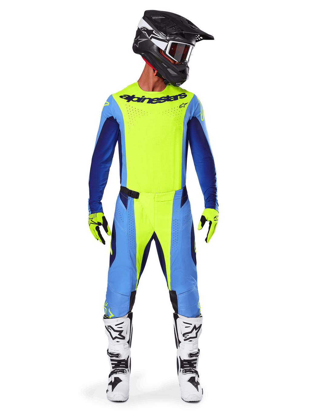Motorcrosser in volledige race-uitrusting, Alpinestars 2025 Techstar Melt Jersey in fluorescerend geel en blauw, bijpassende geel-blauwe motorcrossbroek, zwarte helm met witte graphics en motorcrossbril, wit-zwarte laarzen, geel-zwarte handschoenen, gecoördineerde outfit voor off-road racen