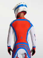 Alpinestars Supertech Vesta jersey in rood en wit met een geventileerd mesh rugpaneel voor professionele motorcross.
