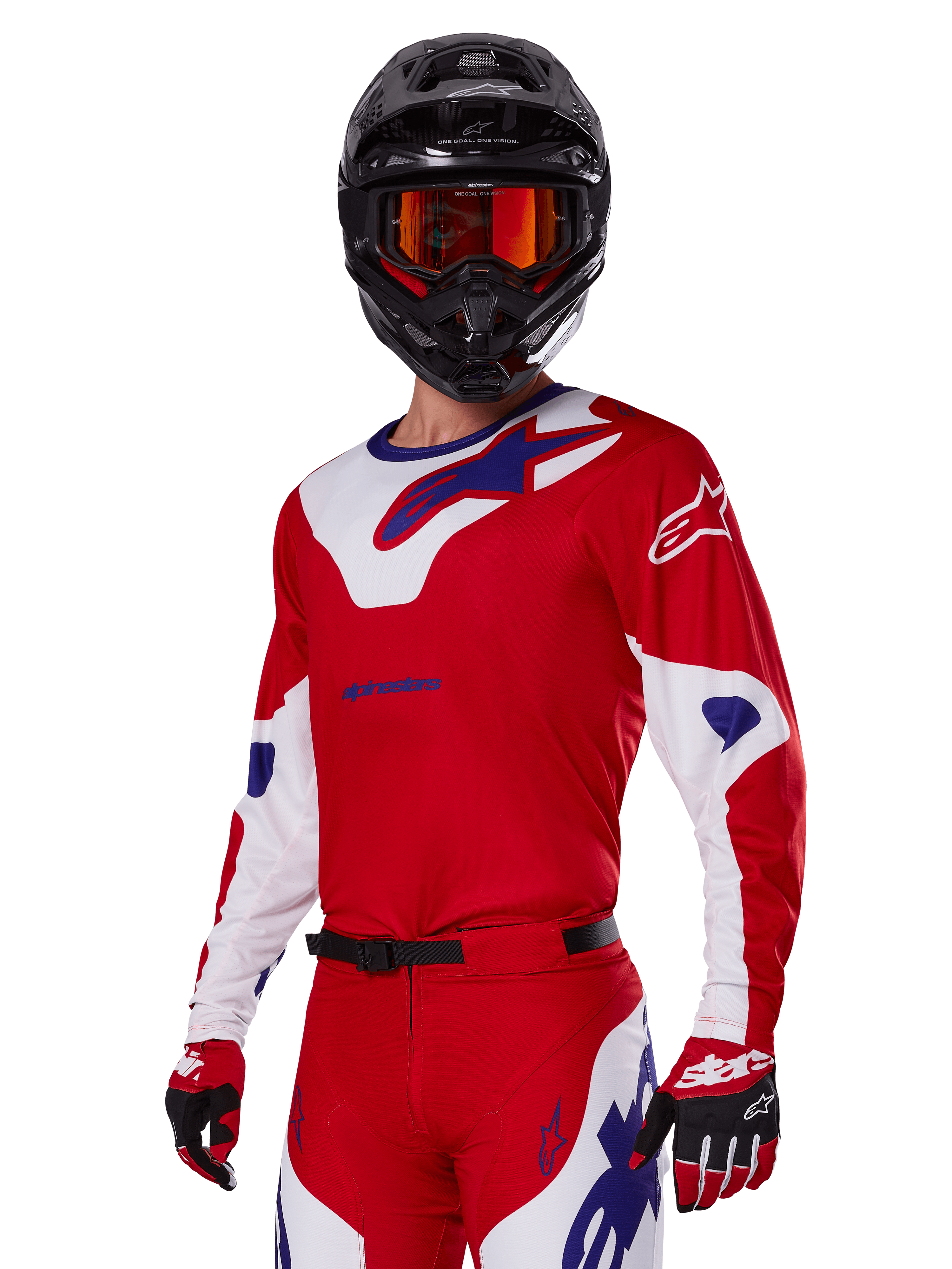 Alpinestars 2025 Racer Veil Gear Set, motocrossrijder met rood, wit en blauw raceshirt en broek, zwarte helm met oranje gespiegelde crossbril, rood-witte handschoenen, technische off-road uitrusting met opvallende branding