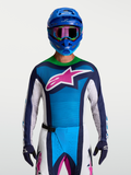 Alpinestars Techstar Maven jersey, blauw en groen motocross-shirt met roze sterlogo en atletische racepasvorm voor terreinrijden.