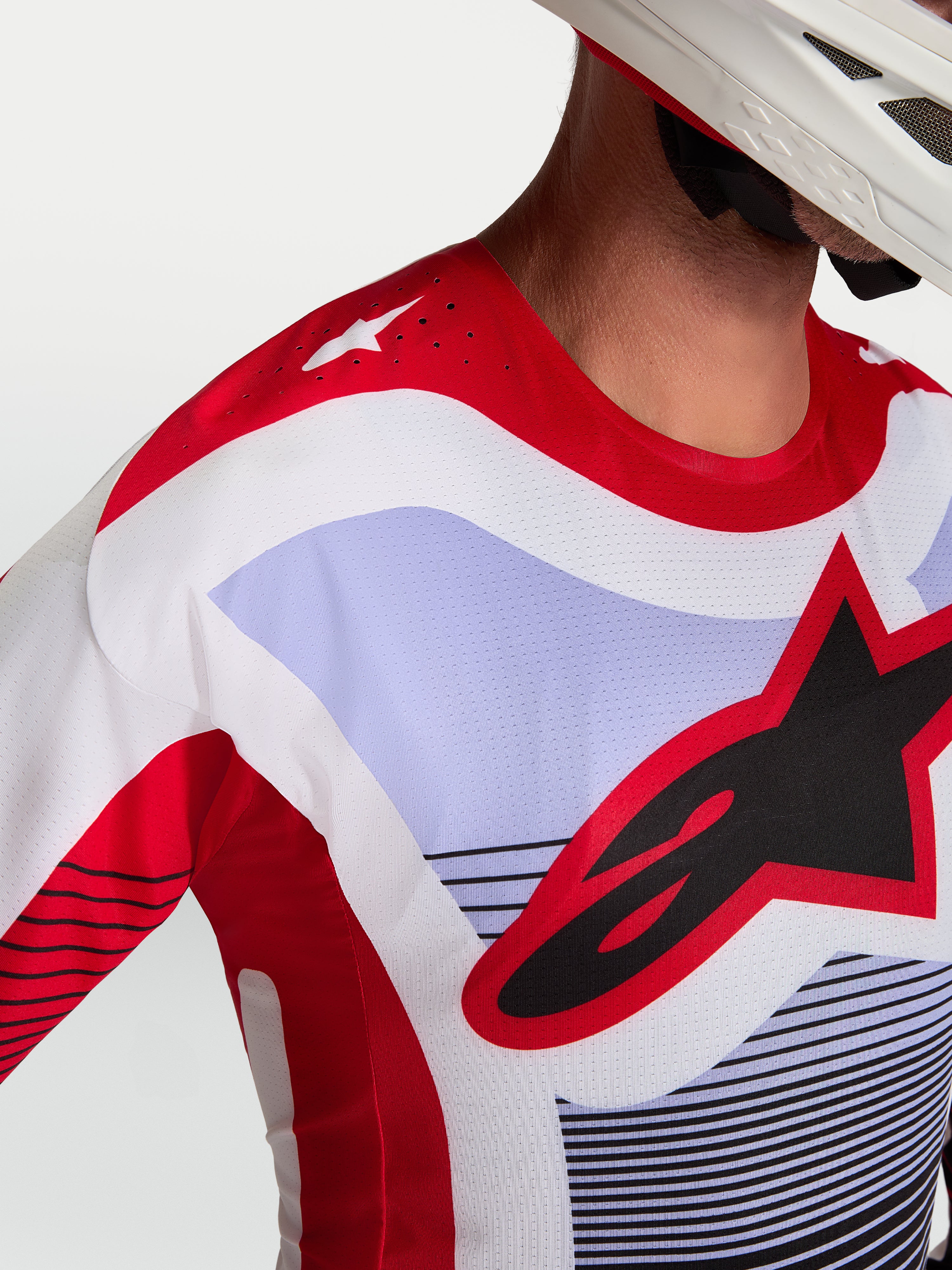 Alpinestars Techstar Maven Jersey, motocross jersey in rood, wit en lavender met lasergesneden ventilatie en atletische pasvorm.
