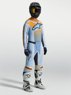 Alpinestars Techstar Maven gear set en jersey, motocross-uitrusting voor heren, blauw en oranje, atletische racepasvorm.