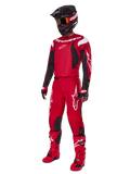 Alpinestars 2025 Fluid Haul Gear Set, motorcrossuitrusting, felrood met zwarte en witte accenten, volledige outfit inclusief jersey, broek, helm, laarzen en handschoenen, ontworpen voor off-road prestaties en bescherming